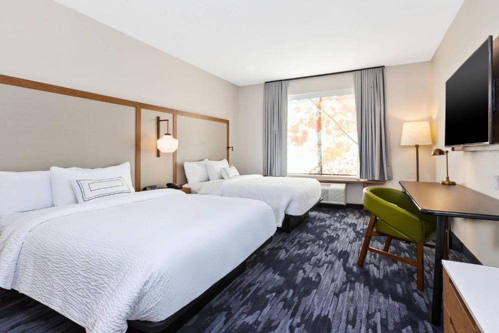 Queen Suite with Two Queen Beds, Sitting Area, Roll-In Shower and Sofa Bed - Mobility Access interior